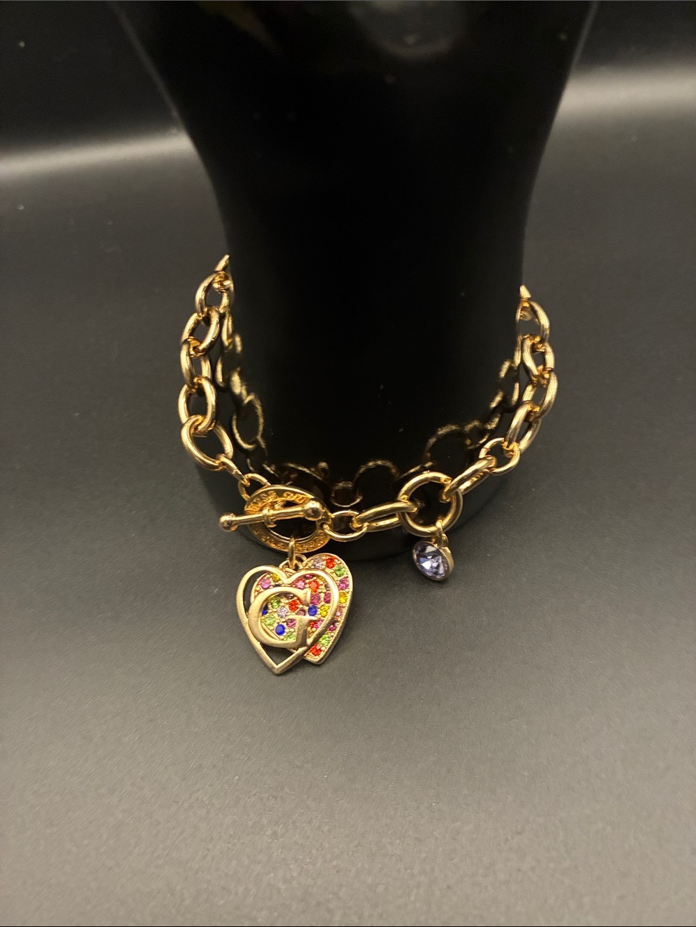 Guess Gold-Tone Heart Charm Bracelet with Multicolor Crystal Accents